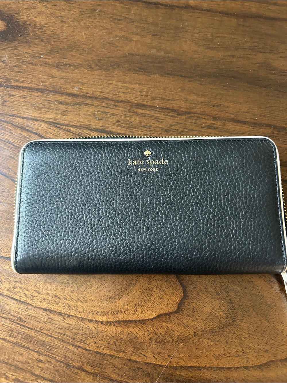 kate spade black pebbled leather zip-around wallet with gold logo